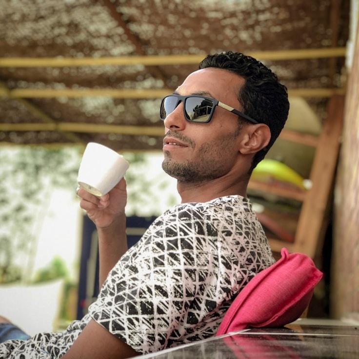 Aria Malik, Lead Design Curator at Byte Craft Studio, reviewing corporate floral arrangements